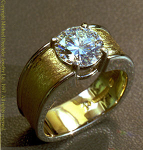 Photo of actual solitaire diamond ring.