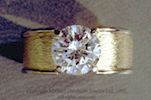 Photo of actual solitaire diamond ring. Top view.